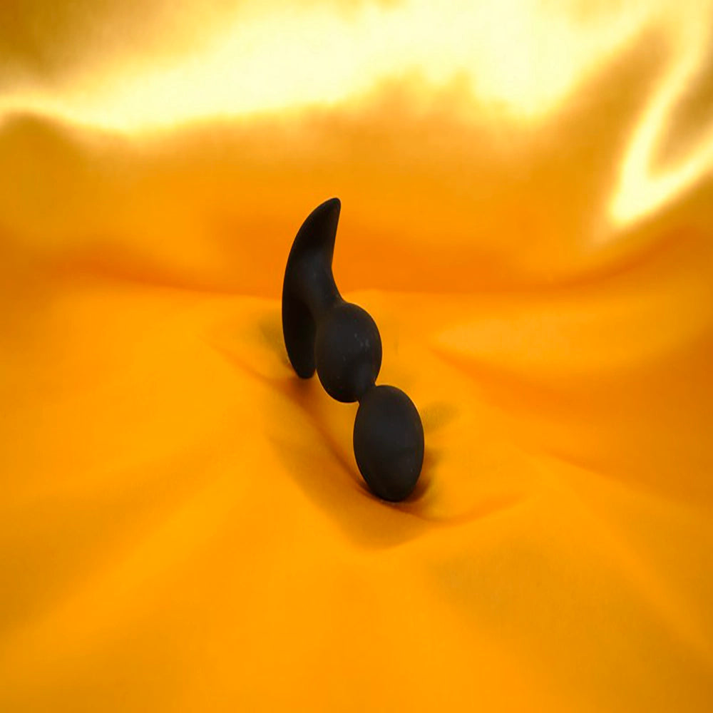 Butt plug with vibrating beads